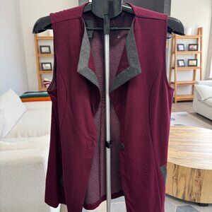 Dennis Basso maroon/burgundy ponte knit vest with grey contrast trim.